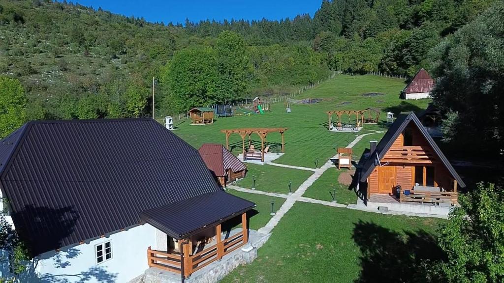 an aerial view of a house with a playground at Vikendica i odmaraliste JuliE, Sarajevo-Jahorina in Tvrdimići
