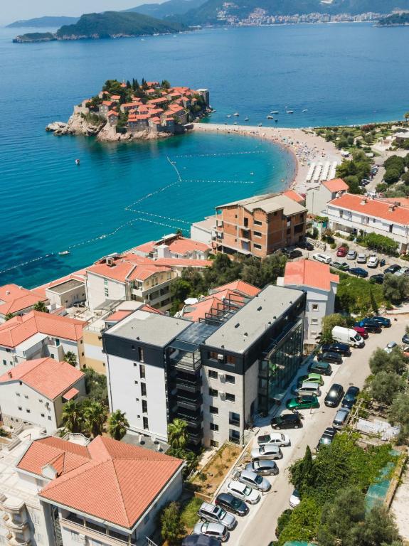 an aerial view of a city with a beach and buildings at Adriatic Masterpiece Residence in Sveti Stefan