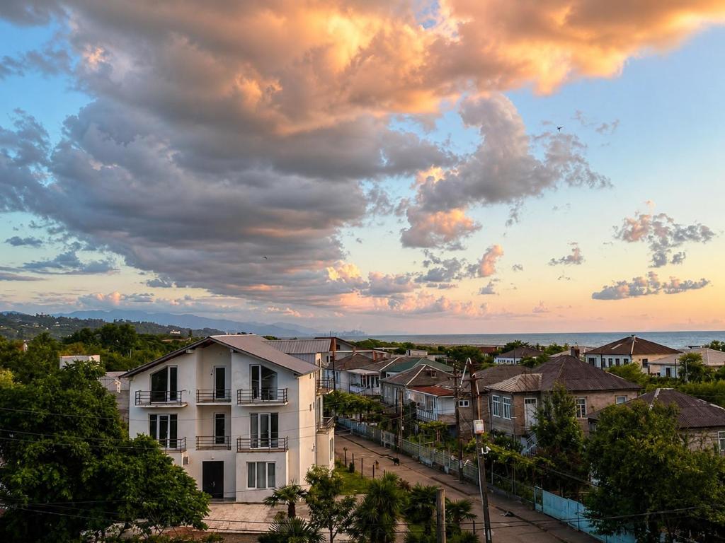 a view of a city with a cloudy sky at Corner house in Kobuleti