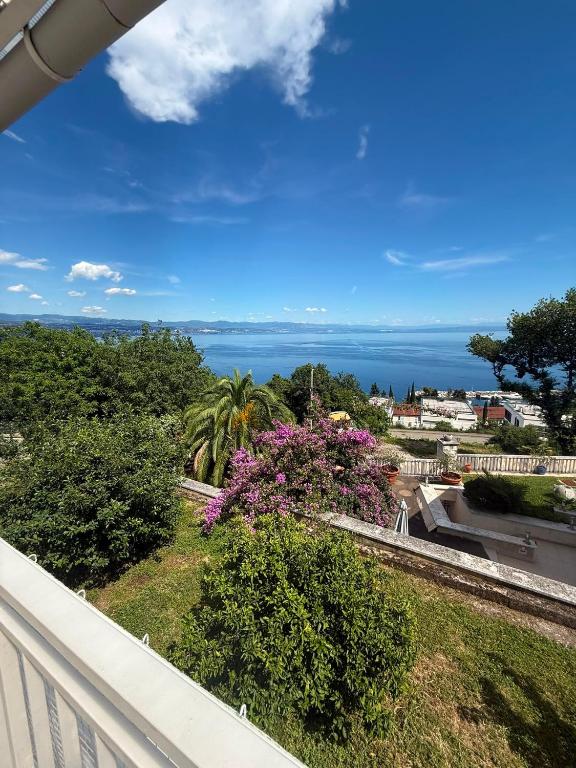 a view of the ocean from the balcony of a house at Vista Esmeralda in Opatija