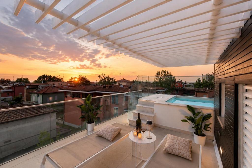 a balcony with a view of a city at Rooftop Pool - VIP Penthouse in Fano
