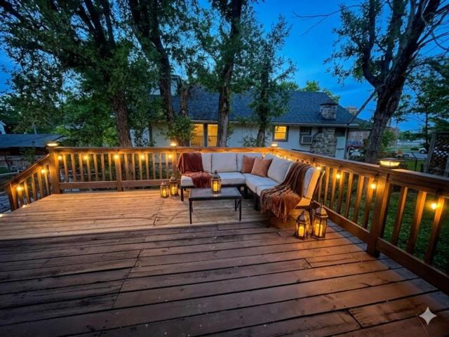 a patio with a couch and lights on a deck at Triple Crown KC in Kansas City