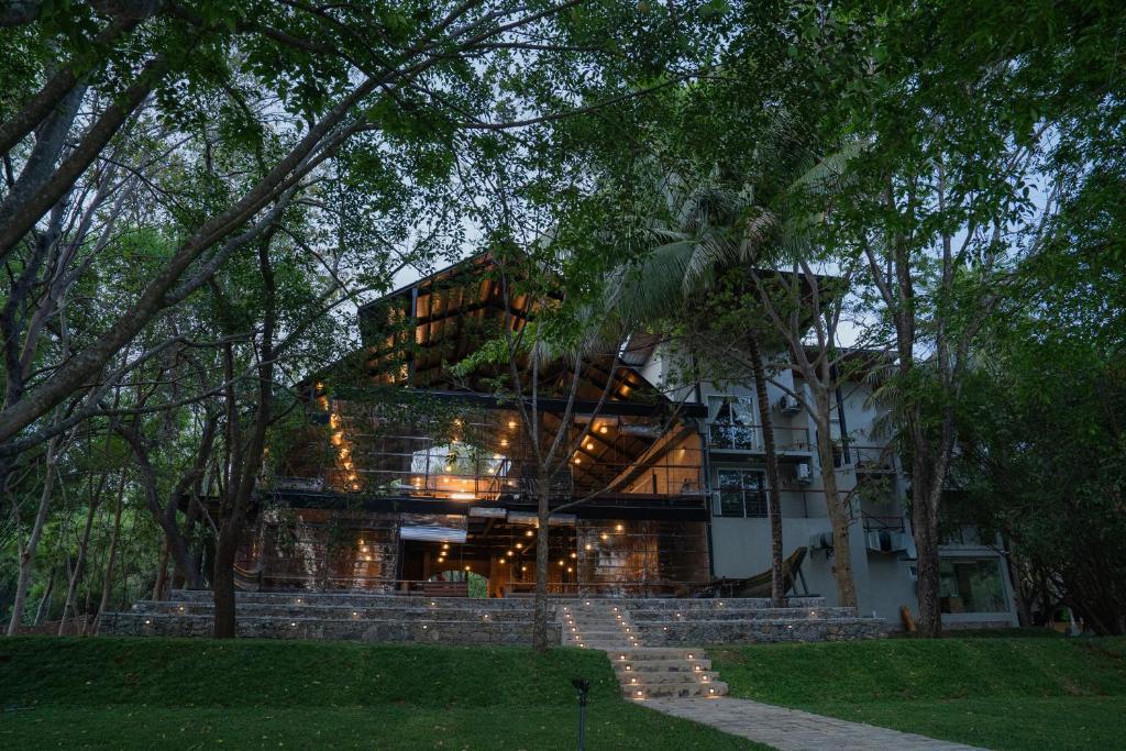 a large house with stairs leading up to it at Camp Thuduwa Udawalawe in Udawalawe