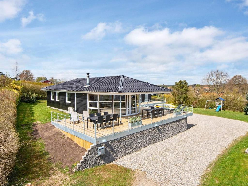 an aerial view of a house with a large deck at Luxury Retreat in Hejlsminde in Hejls