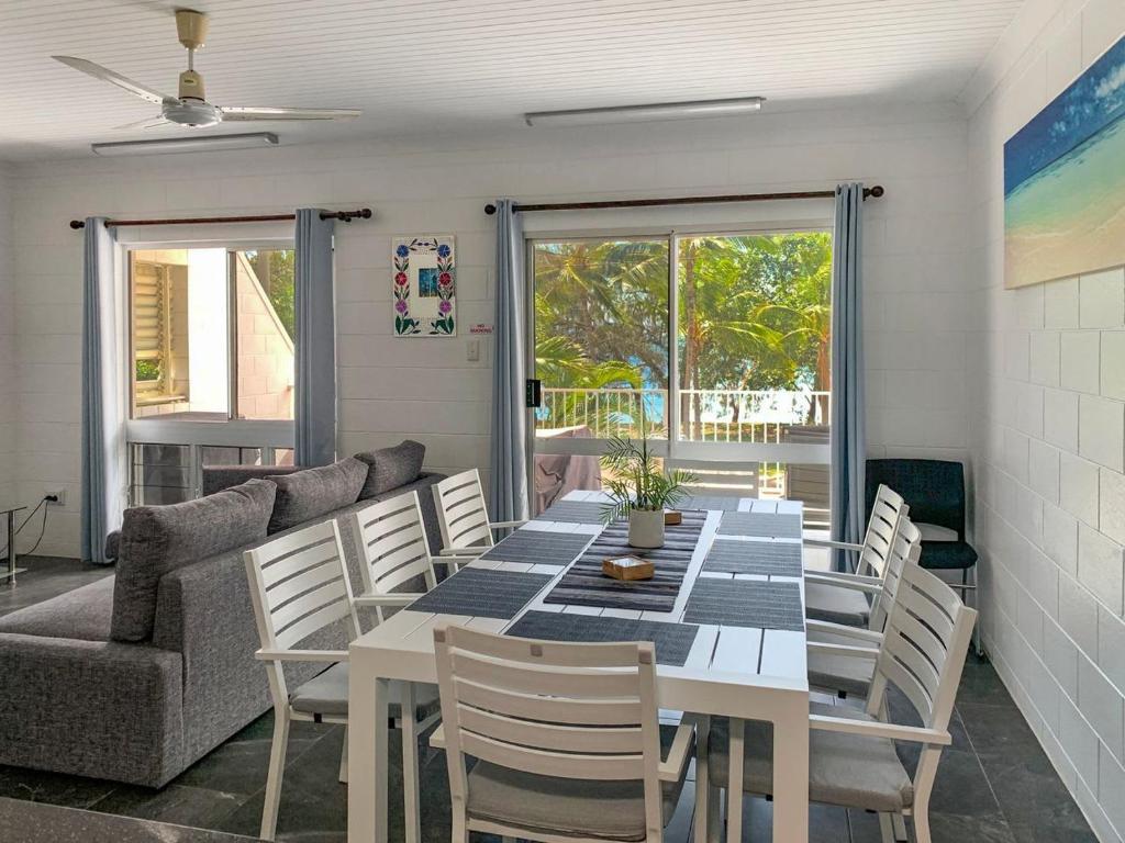 a dining room with a table and chairs and a couch at Arcadia Beach Unit 3 in Arcadia