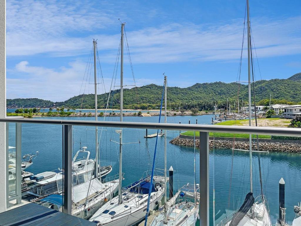 a view of a marina with boats in the water at Blue on Blue Studio Room 1352 in Nelly Bay