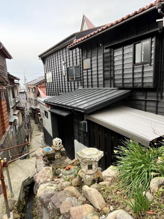 a house with a garden in front of it at NouHarborVilla in Itoigawa