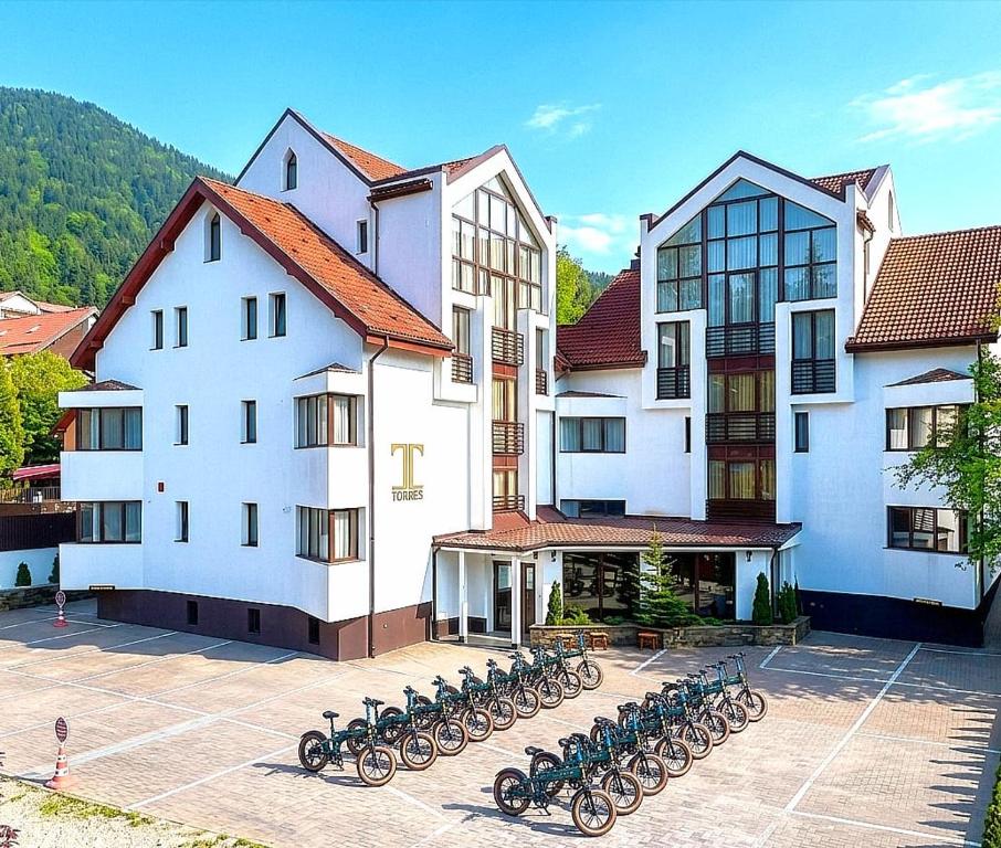 a group of bikes parked in front of a building at Torres Poiana Boutique in Poiana Brasov