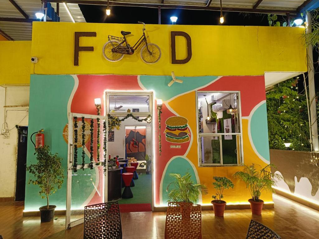 a trade show exhibit with a bike on the wall at Rajputana cafe and restaurant in Dausa