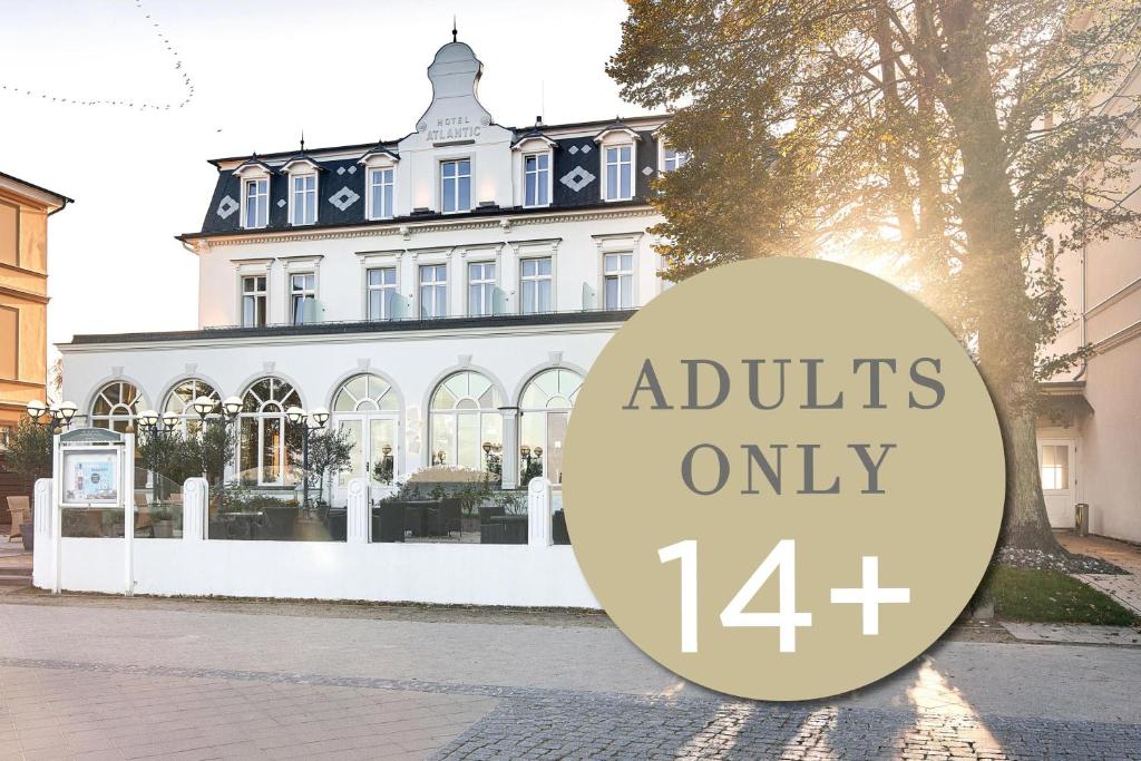 a building with a sign that reads adults at SEETELHOTEL Strandhotel Atlantic das Boutiquehotel am Meer in Bansin