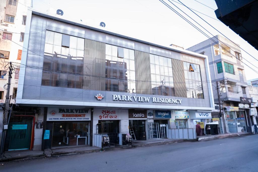 a building on the side of a street at StayGuru Park View Residency in Bhuj