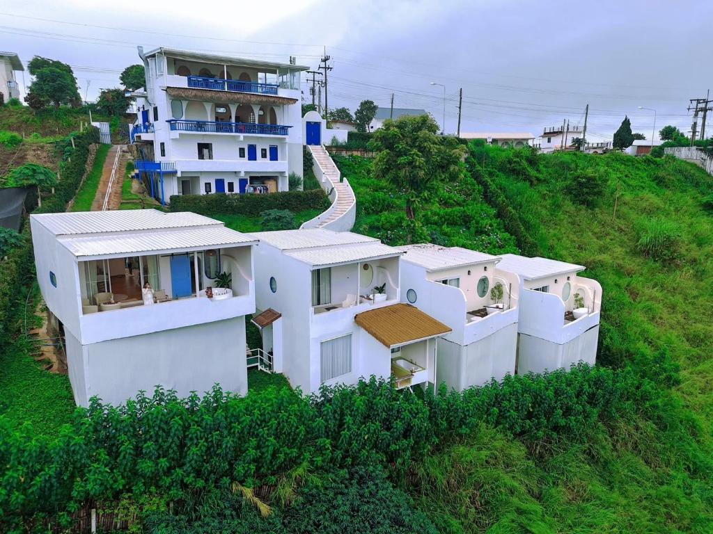 an aerial view of a white house on a hill at Nontawa Villa Doichang in Ban Huai Khai