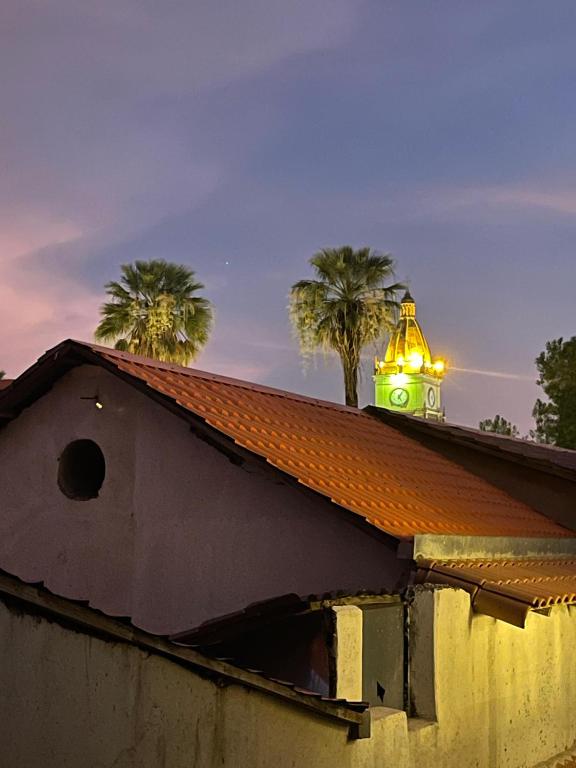 a building with a light on the top of it at Plaza Central Boutique House in Cochabamba