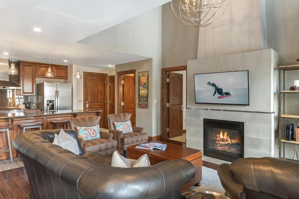 a living room with a couch and a fireplace at 406 The Ascent in Avon