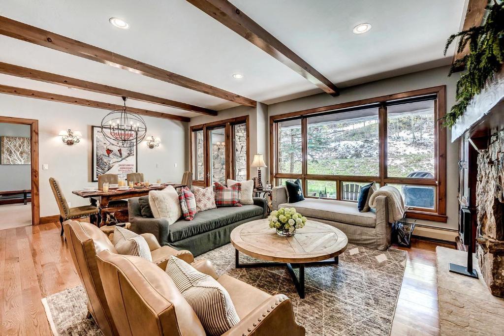 a living room with a couch and a table at 205 Bear Paw Lodge in Avon