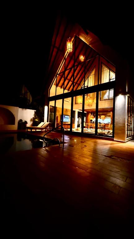 a building lit up at night with at Kilimanjaro Haven Villas in Shiri