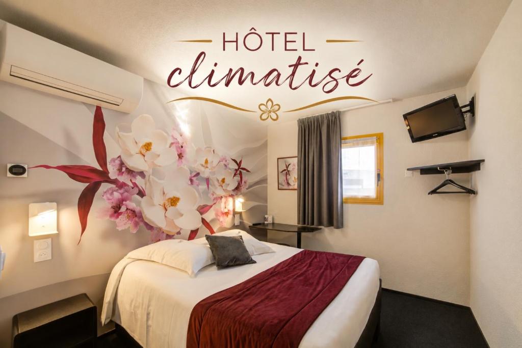 a hotel ultimate sign in a room with a bed at Hôtel The Originals Access, Bourges Nord Saint-Doulchard in Bourges