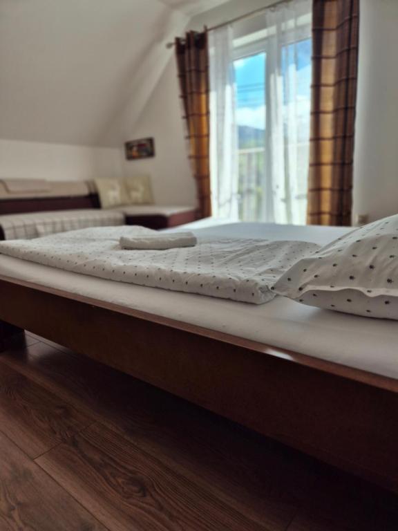a close up of a bed in a room at Relax Penzion U Adama in Dolná Tižina