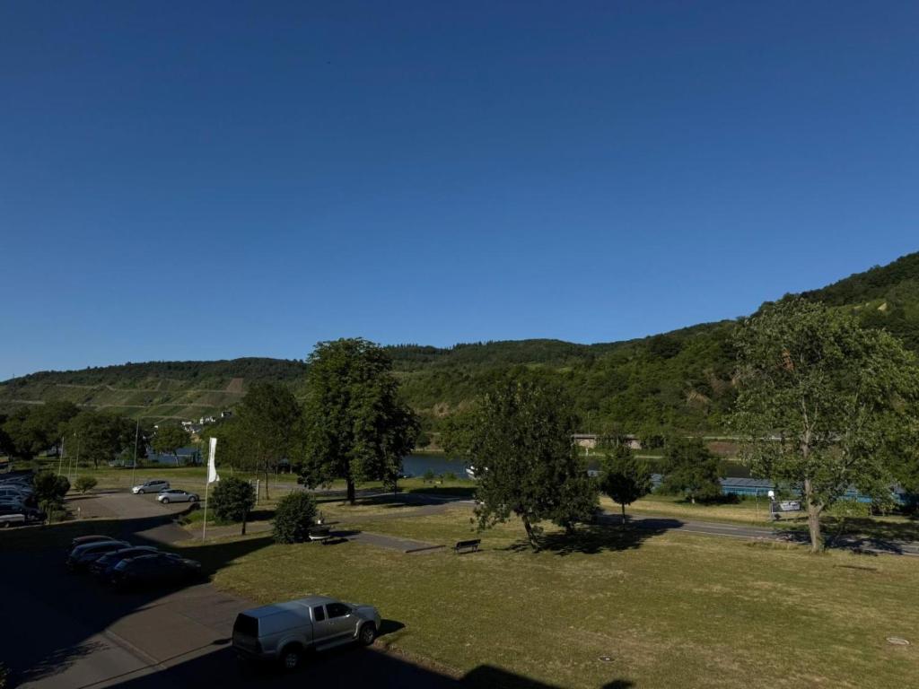 a car parked in a parking lot with mountains in the background at Casa del Mondo 4 in Sankt Aldegund
