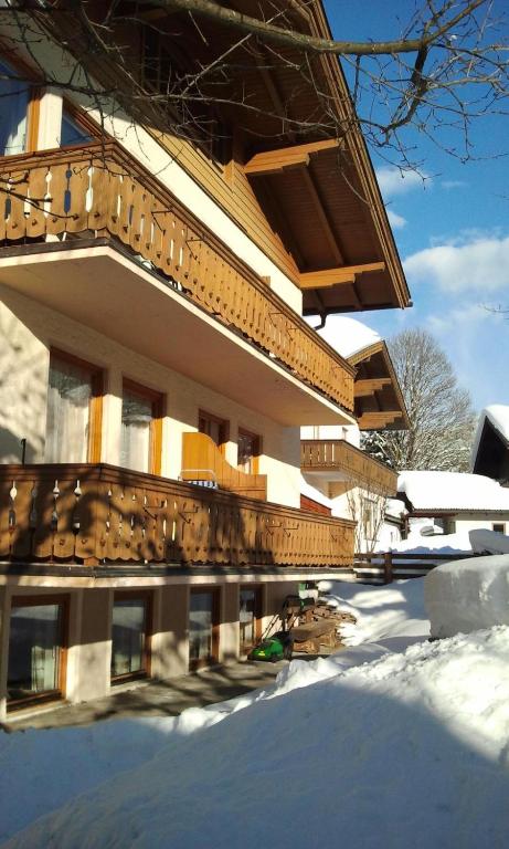 a building with snow in front of it at Appartementhaus Grocke in Wagrain