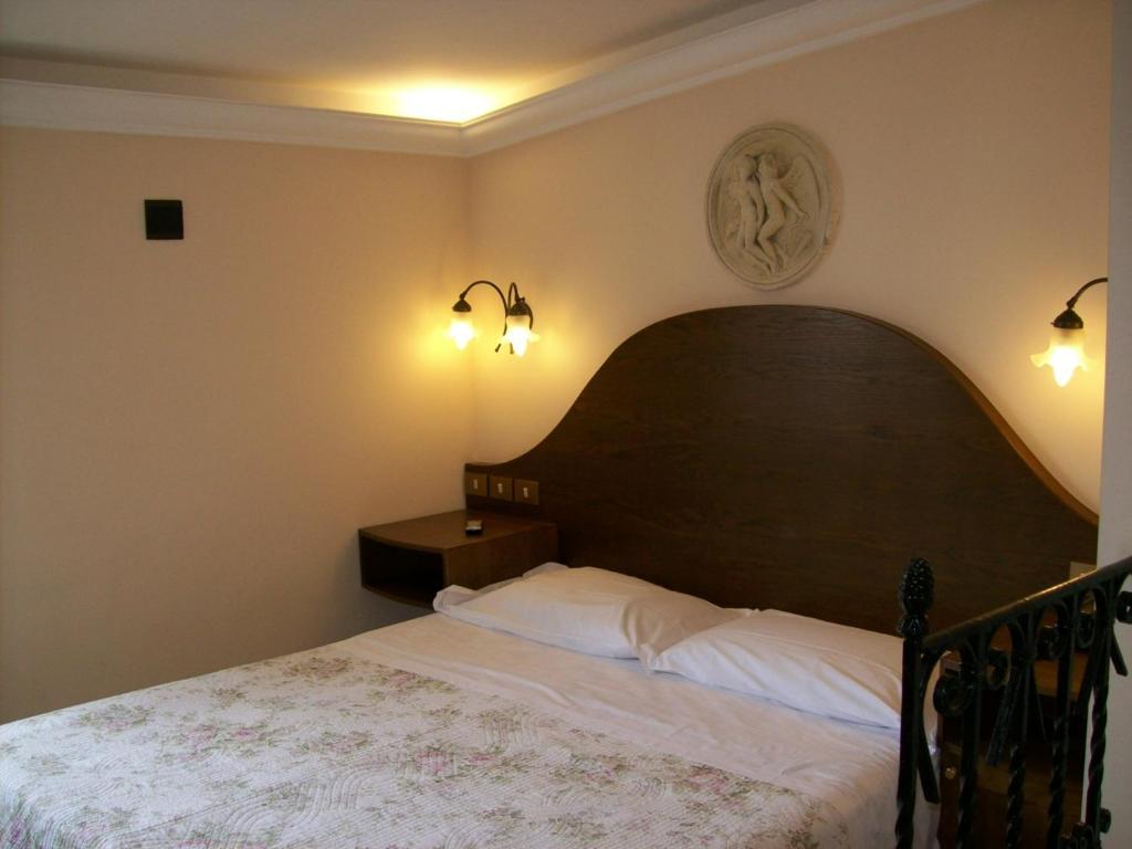 Postel nebo postele na pokoji v ubytování Hotel Prati