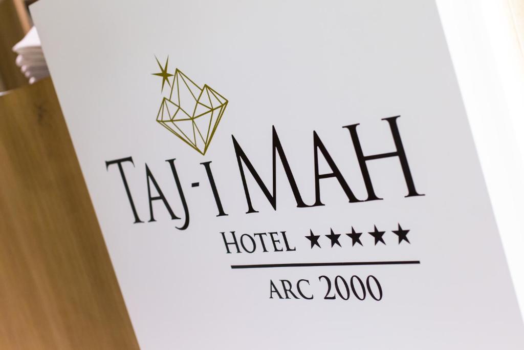 a sign for a hotel with a diamond logo at Hôtel Taj-I Mah by Les Etincelles in Arc 2000