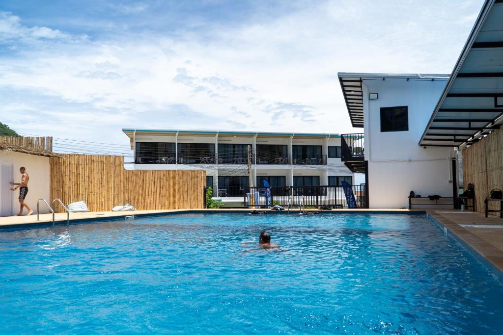 a person in a swimming pool in a building at Buddha View Hostel & Diving in Ko Tao