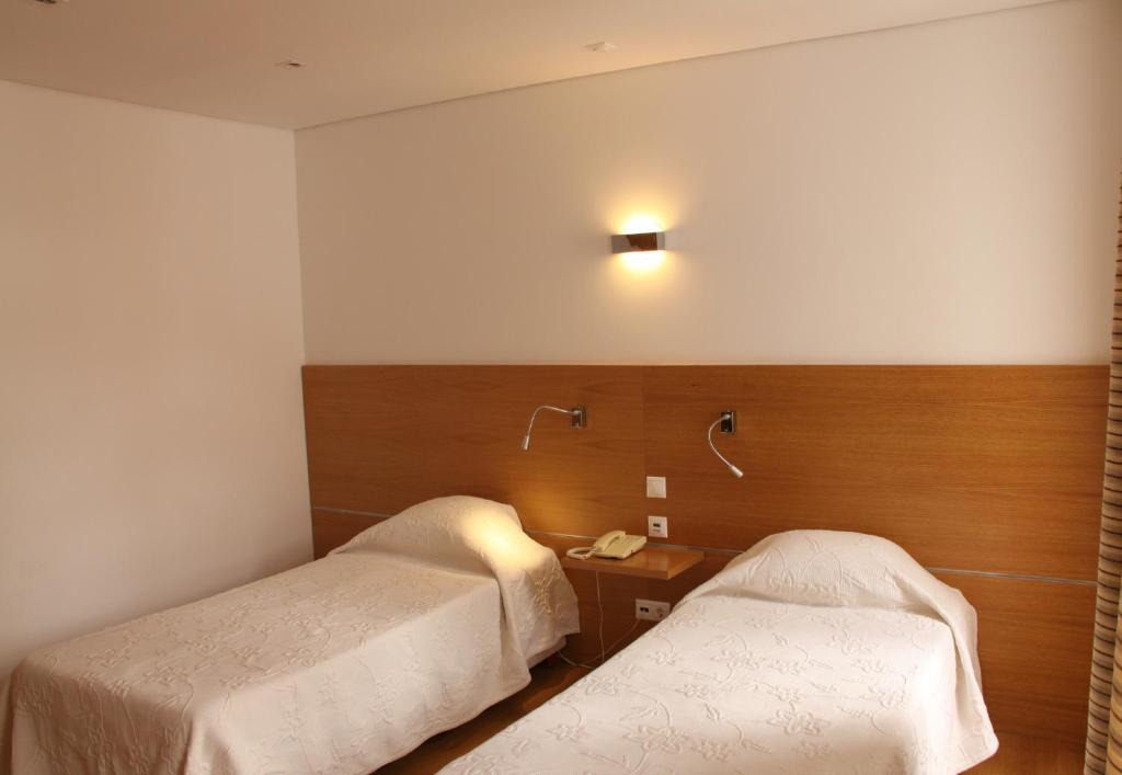 Postel nebo postele na pokoji v ubytování Hotel Zenite