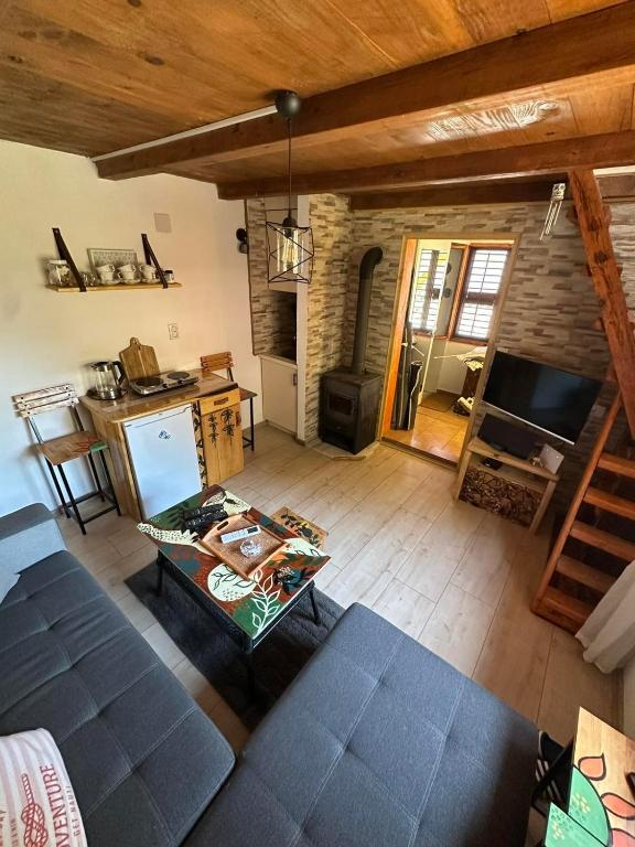 an overhead view of a living room with a couch and a kitchen at Two Olives Vacation Homes in Slatina Varoš