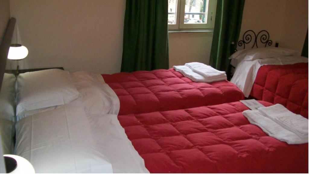 Postel nebo postele na pokoji v ubytování Hotel Prati