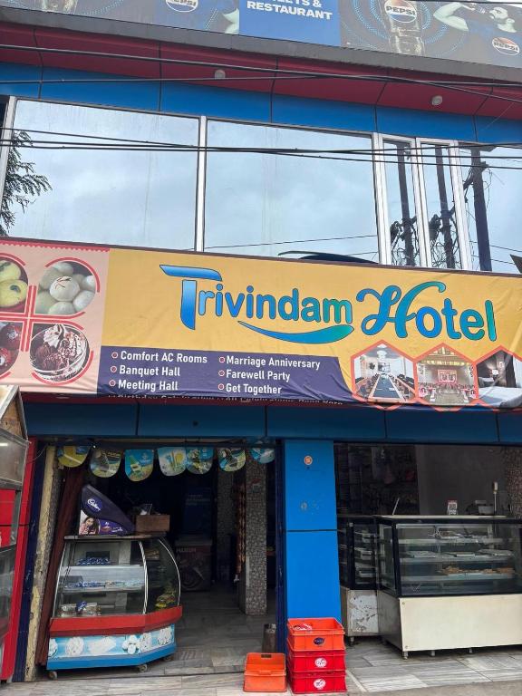 a turuvian hotel sign on the side of a building at Trivrindam Hotel in Gorakhpur