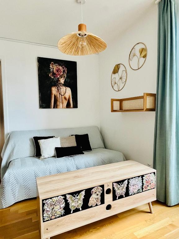 a small bedroom with a bed with a dresser at Modern 1-Bedroom Retreat in Lausanne