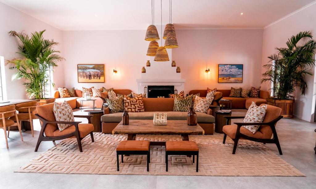 a living room with a couch and a table at Sedia Hotel in Maun