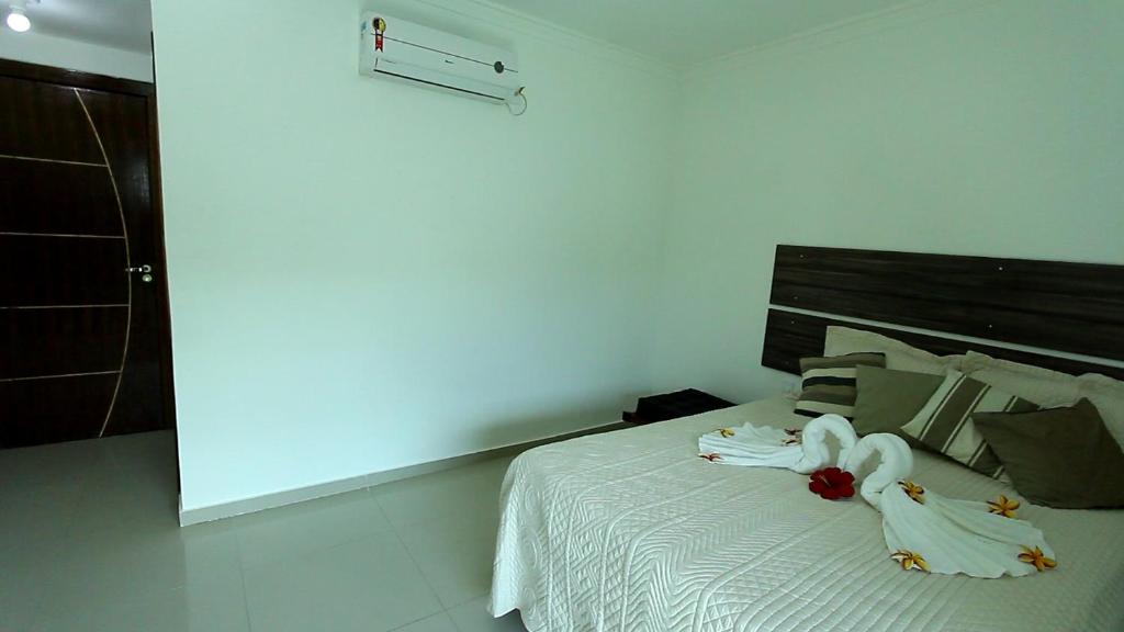 Postel nebo postele na pokoji v ubytování Hotel Pousada Oasis
