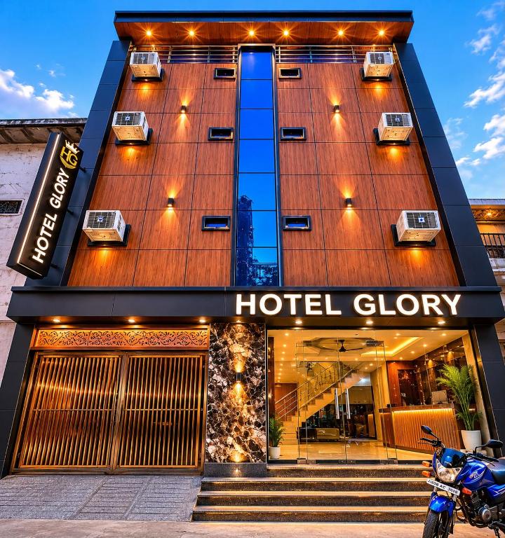 a hotel glory with a motorcycle parked in front of it at hotel glory in Haridwār