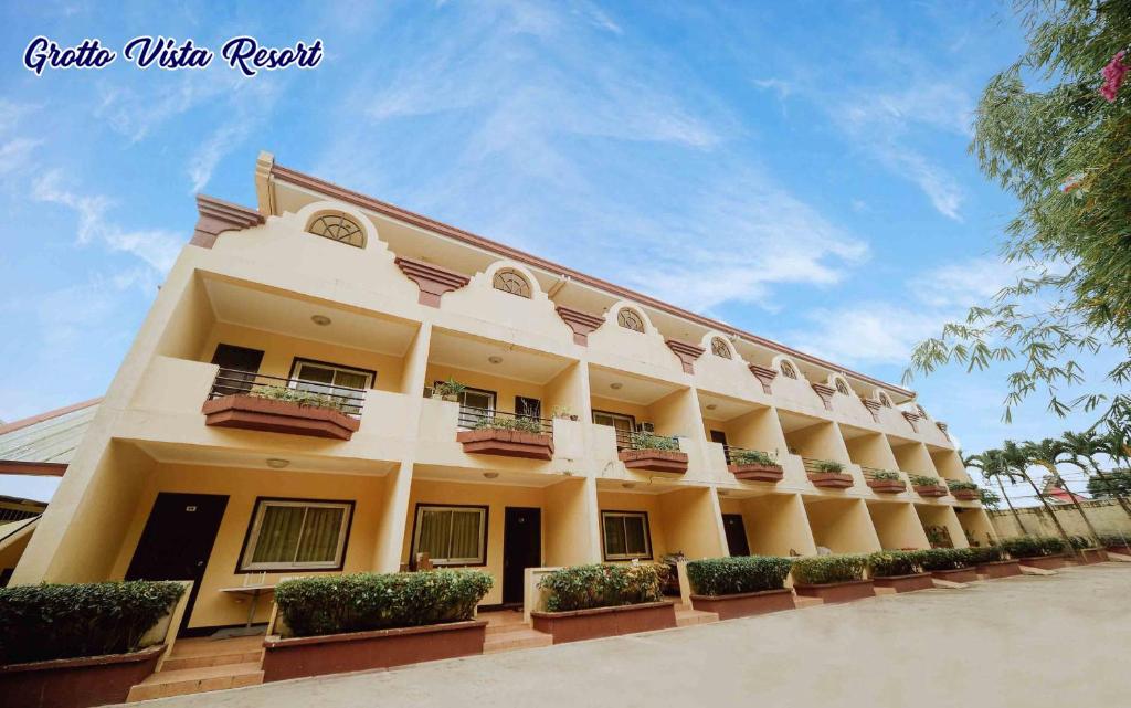 a large building with balconies and plants on it at Grotto Vista Resort in San Jose del Monte