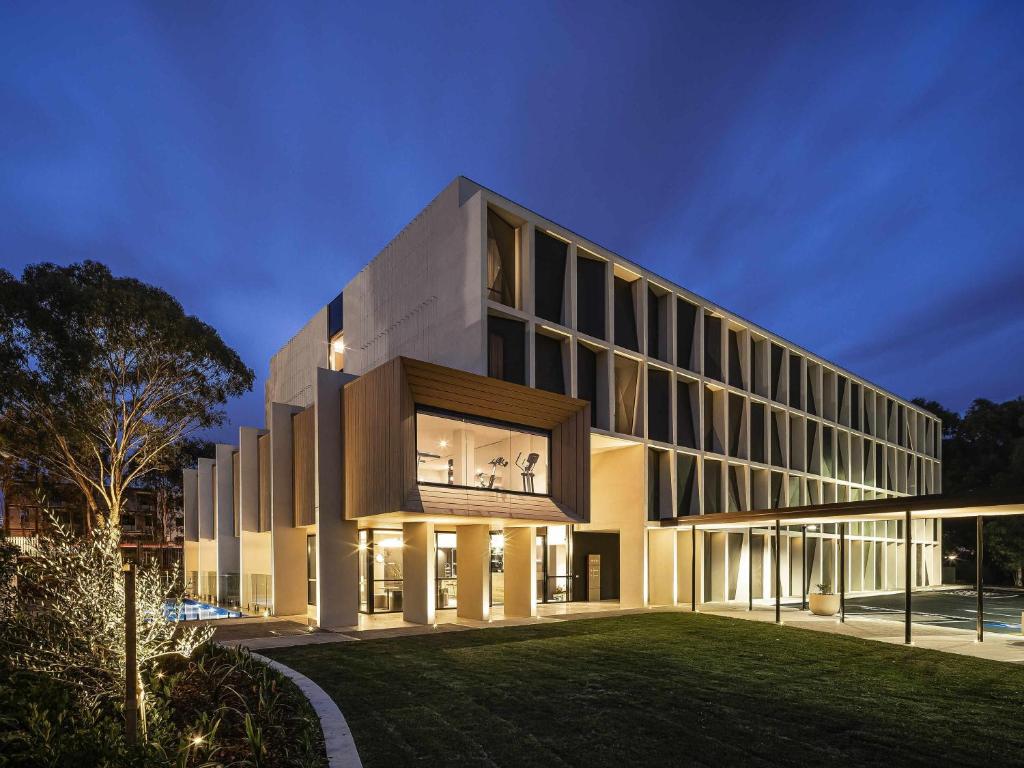 an external view of a building at night at Mercure Sydney Rouse Hill in Kellyville