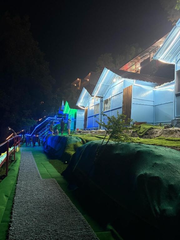 a building lit up at night with at Shivpuri Ghumakkad Resort in Shivpuri