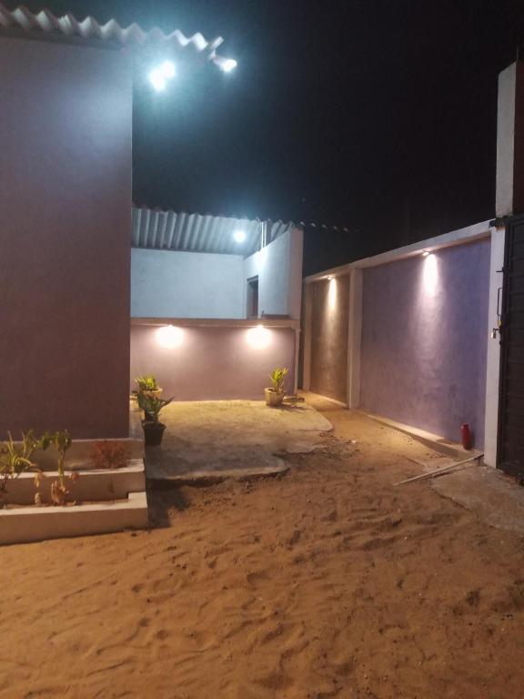 an empty garage at night with lights on it at HELLO MADHi VILLA in Arugam Bay