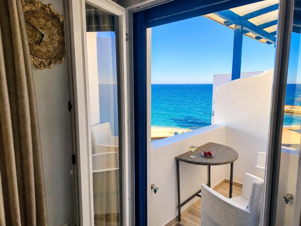 a room with a view of the ocean at Bella Vista Mare 2 in Moutsoúna