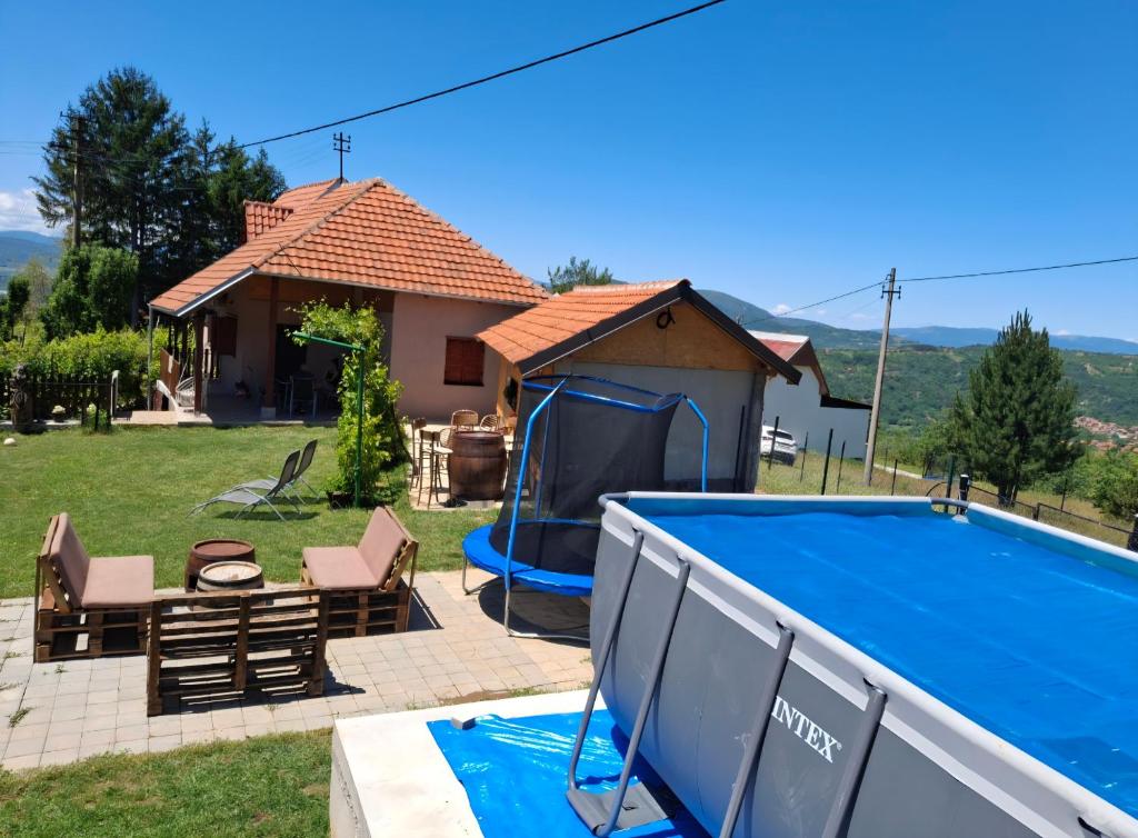 a villa with a pool and a house at Vikendica i apartman HS in Pirot