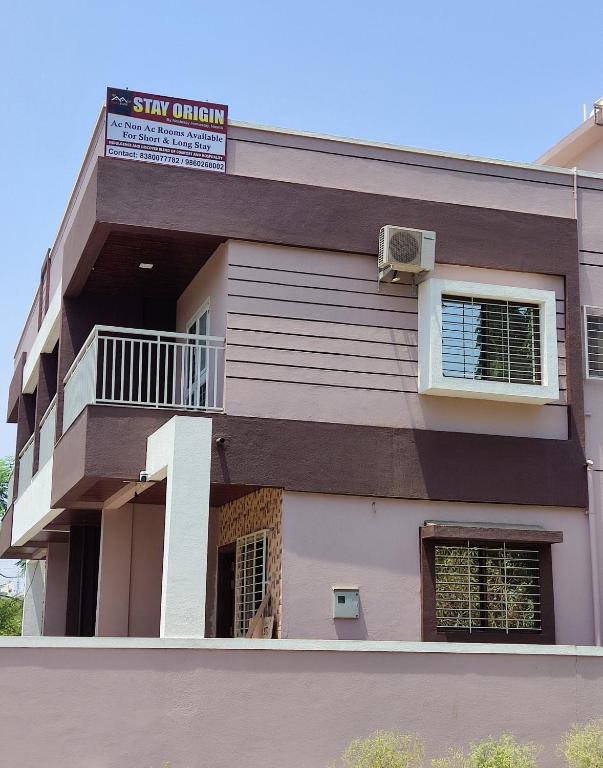 a building with a sign that reads stay original at Stay Origin, In Nashik in Nashik