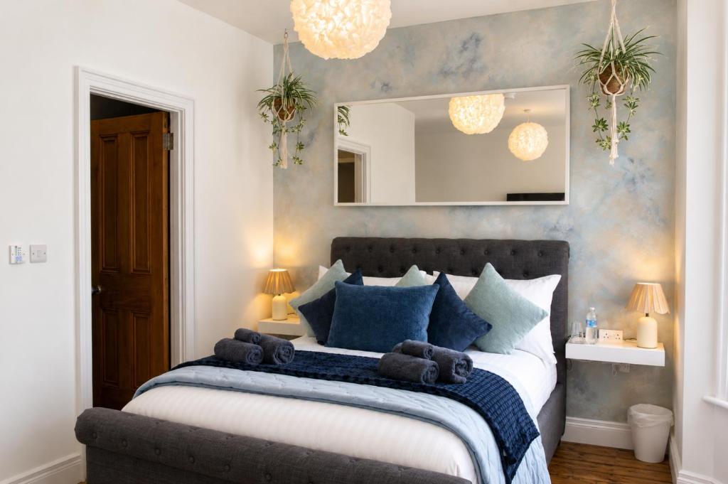 a bedroom with a bed with teddy bears on it at Lavina by the sea in Bangor