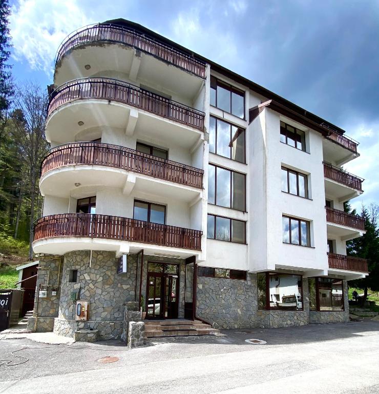 a large building with balconies on top of it at Vila Predeal Holidays in Predeal