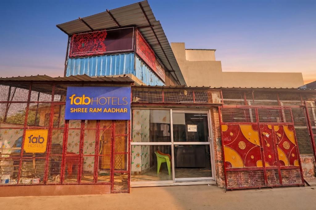 a store front with a sliding glass door at FabHotel Shree Ram Aadhar 900 Mtr from Ram mandir in Ayodhya