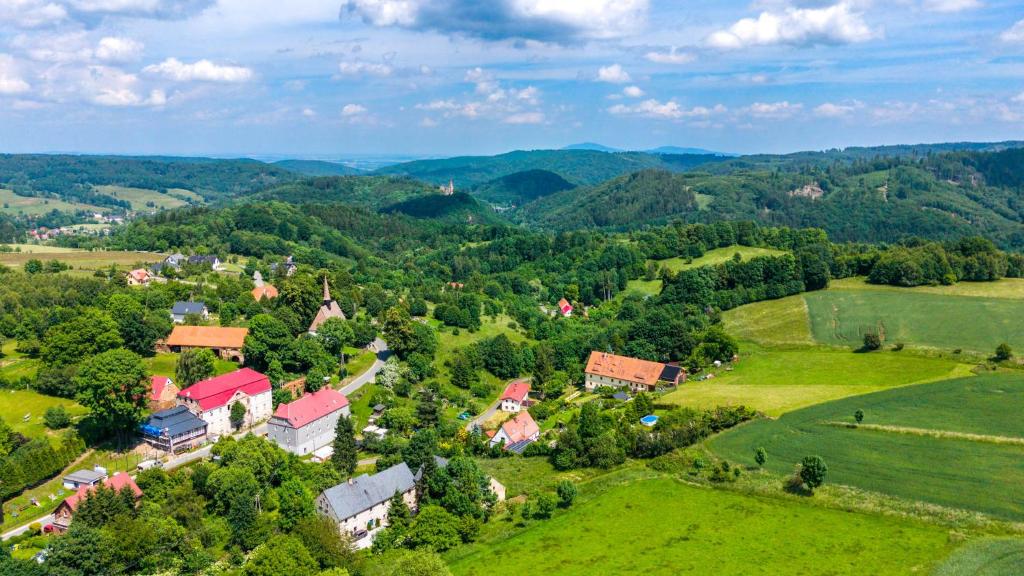 an aerial view of a small village in the hills at Przytulne Siedlisko in Jugowice