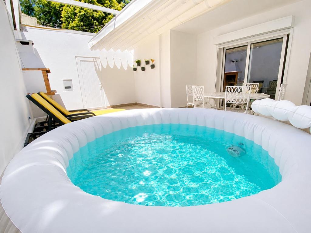 a hot tub in the middle of a patio at Jack&Lily's in Évora