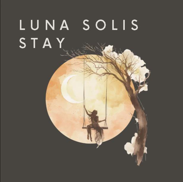 a book cover of a woman on a swing over a tree at Luna Solis Stay Zimmer und Hostel nahe A1 in Heidenau