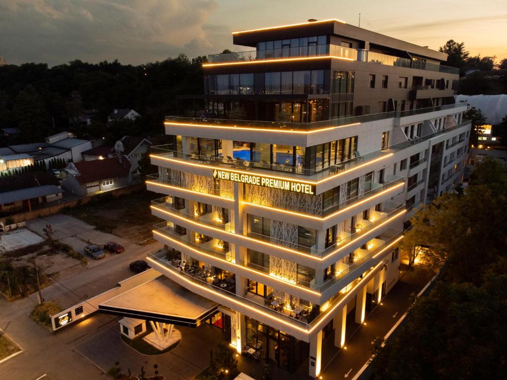 a large white building with lights on at New Belgrade Premium Hotel in Belgrade