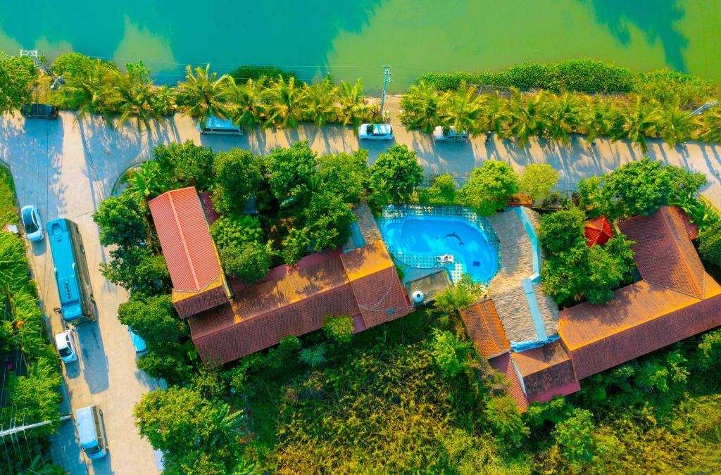 an aerial view of a resort with a swimming pool at Tam Coc Riverside Bungalow in Ninh Binh